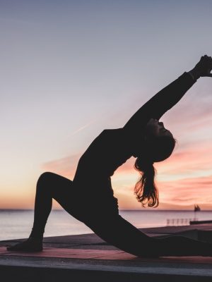 silhouette photography of woman doing yoga